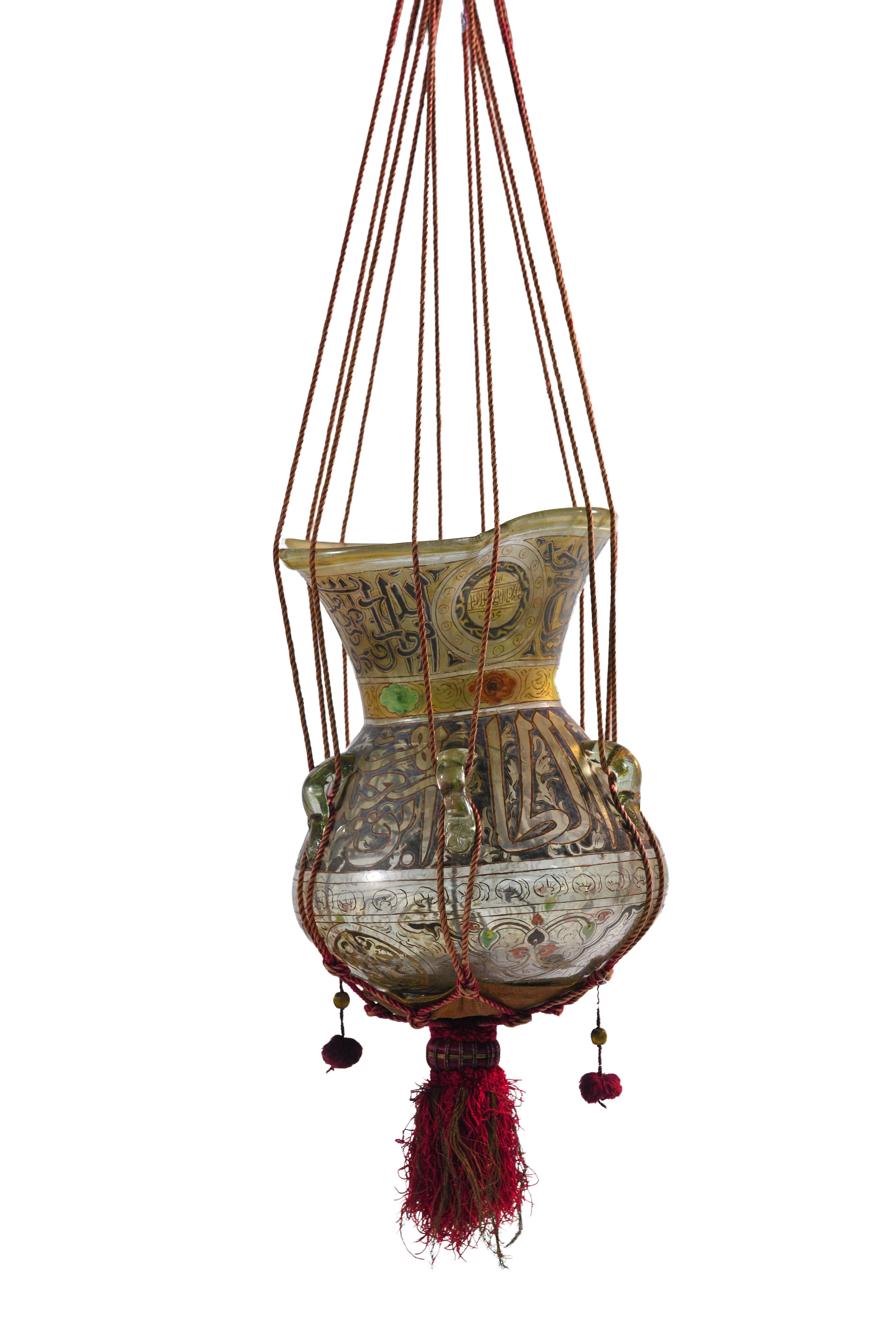 Mosque lamp Possibly Egypt, 13th/19th century Blown, enameled and gilded glass lamp: h. 35; suspension ball: h. 17; total: 110 cm King Abdulaziz Center for World Culture — Ithra, Dhahran. 