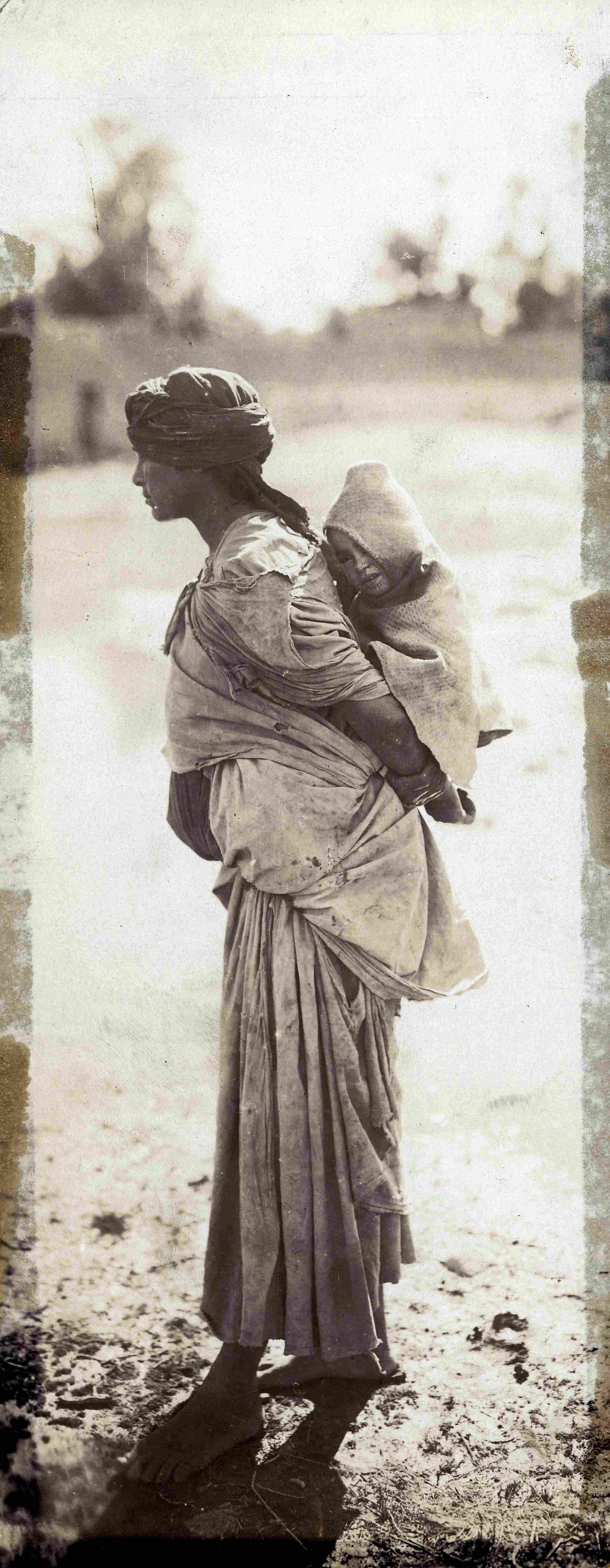 ‘Local woman carrying a sleeping child on back,’ photographed by Alexandre Bougault. (1851-1911). (HC.HP.2017.0001-0008). Courtesy of Qatar National Library.&nbsp;
