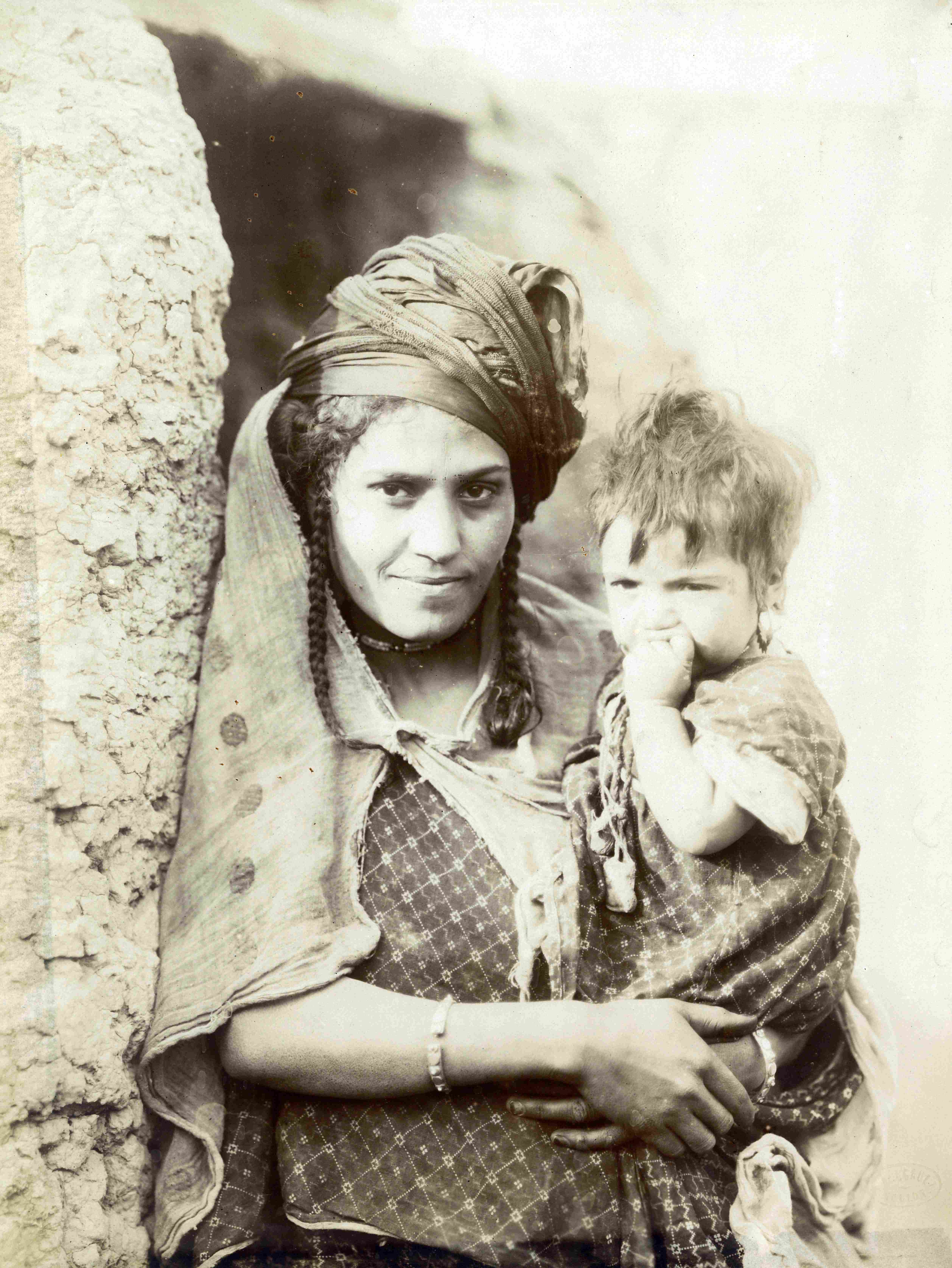 ‘Local woman carrying her child,’ photographed by Alexandre Bougault. (1851-1911). (HC.HP.2017.0001-0009). Courtesy of Qatar National Library.