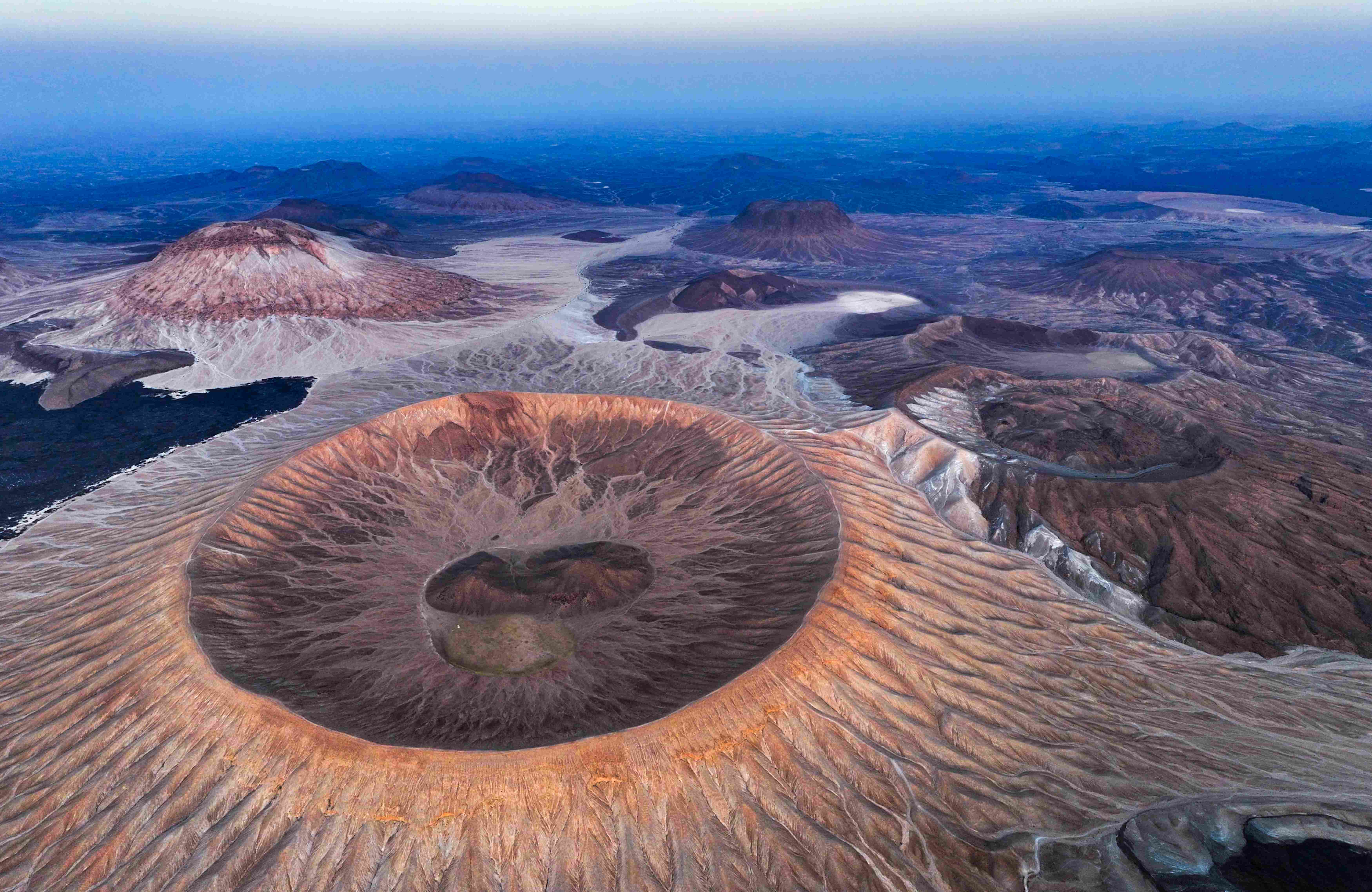 White dome crater in Harrat Khaybar, Al-Madinah Province, one of the world's rare volcanic craters due to its distinctive white color. Courtesy of Ibrahim Sarhan. 