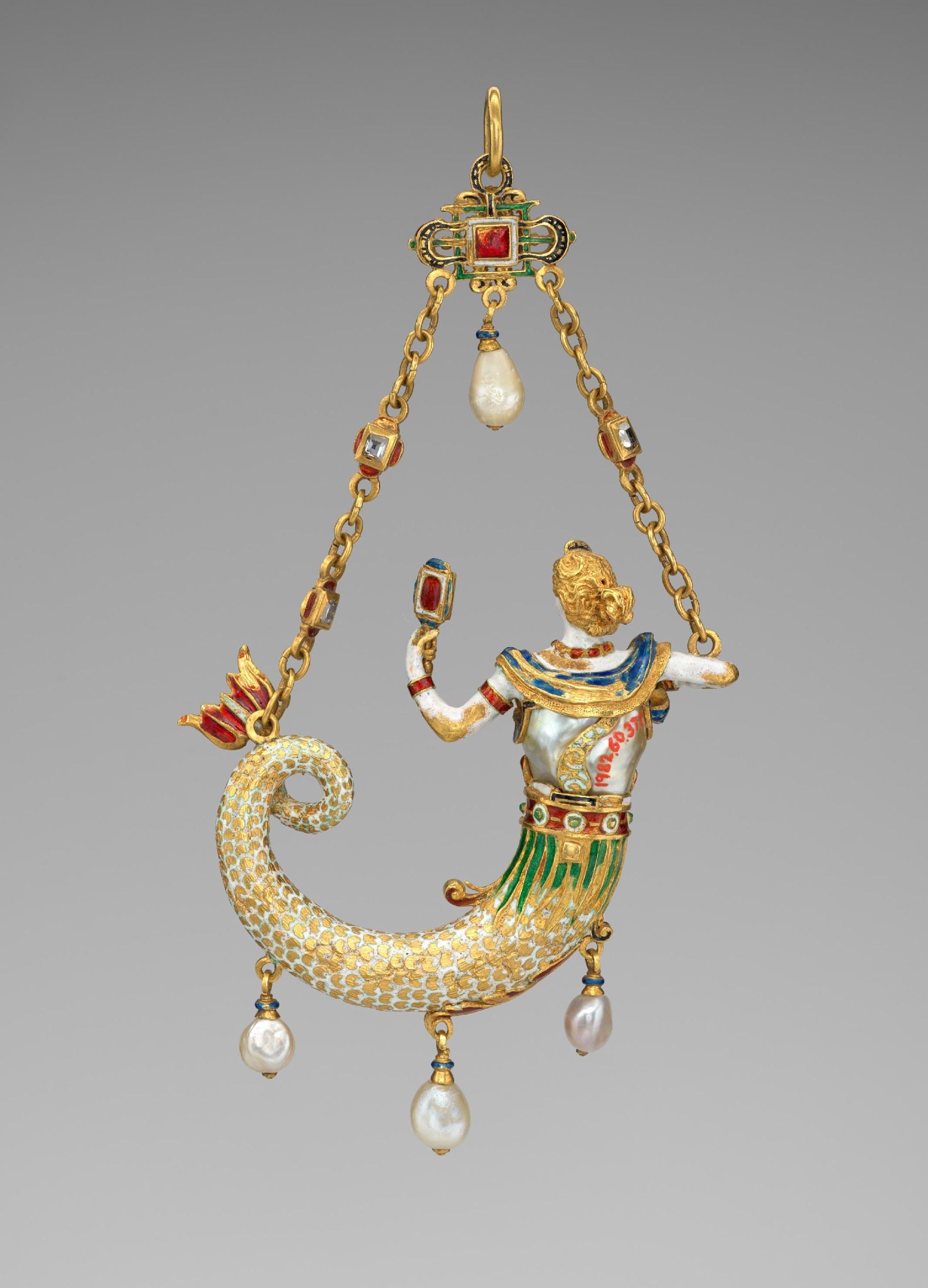 Pendant in the form of a mermaid, probably based on a design by Reinhold Vasters. Circa 1870-1895. Baroque pearl with enameled gold mounts set with diamonds and pendant pearls. Height of 12.4 cm. Credit to The Jack and Belle Linksy Collection, 1982.