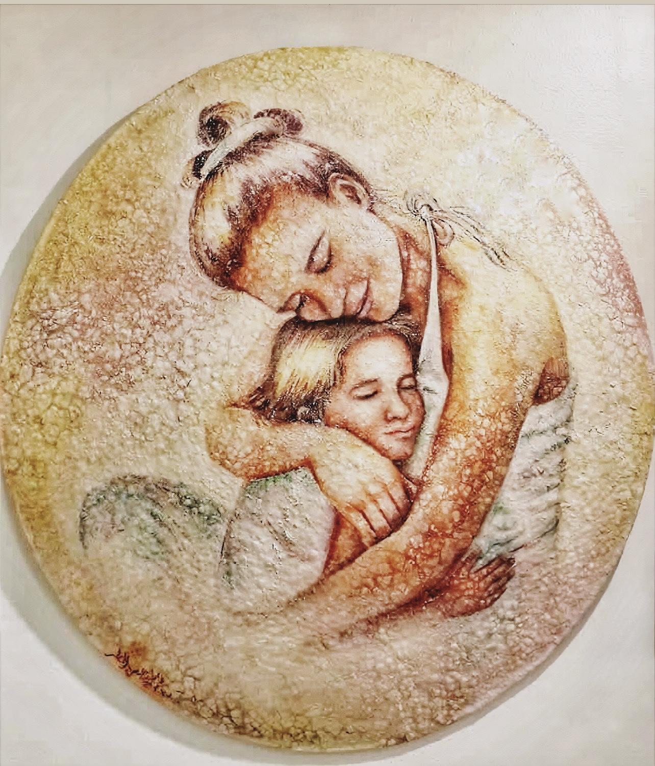 Fatima Al MatarThis piece was created in a mosaic style, using eggshells arranged on a circular plate measuring one meter by one meter. Through this delicate material, the work expresses a mother’s embrace and the way she cares for her children, a sacred bond we are born into, a relationship unlike any other. 