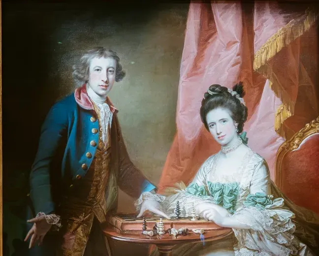 ‘Portrait of William and Penelope Welby Playing Chess.’ Francis Cotes. 1769. United Kingdom. Oil on Canvas. 135 x 152 cm (unframed). Credits: Louvre Abu Dhabi © Department of Culture and Tourism - Abu Dhabi. Photo by APF. LAD 2013.007&nbsp;&nbsp;