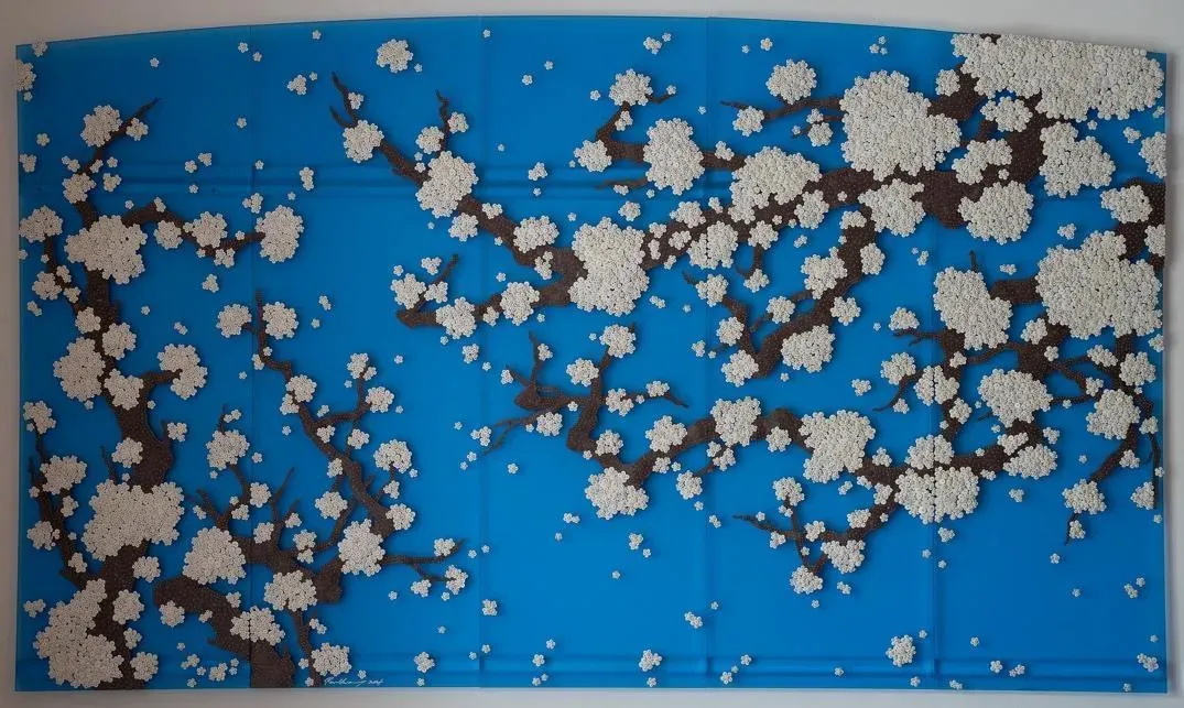 ‘Becoming Again_BSA’. Ran Hwang. 2025. Mulberry paper buttons, beads, pins on Plexiglas.177 x 300 cm. Courtesy of Leila Heller Gallery and Ran Hwang.&nbsp;
