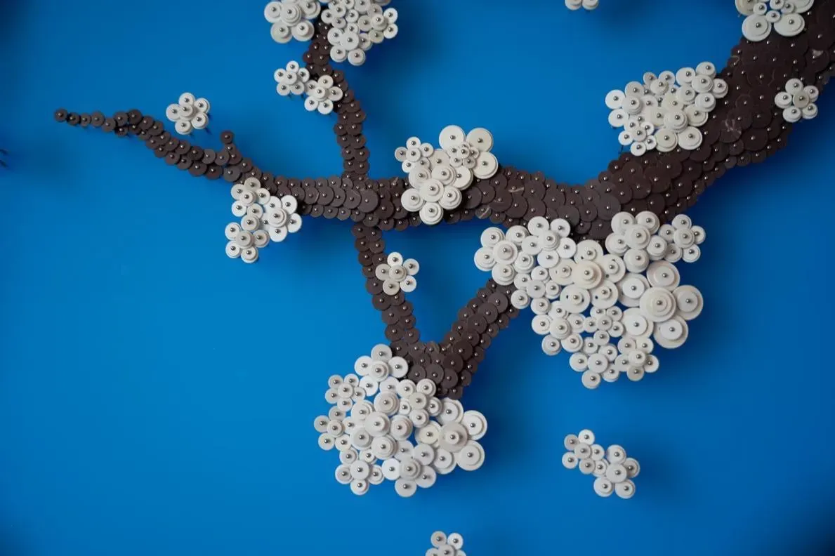 ‘Becoming Again_BSA’. Ran Hwang. 2025. Mulberry paper buttons, beads, pins on Plexiglas.177 x 300 cm. Courtesy of Leila Heller Gallery and Ran Hwang.&nbsp;